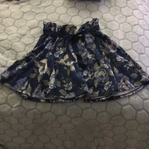 Blue floral mid-length skirt.